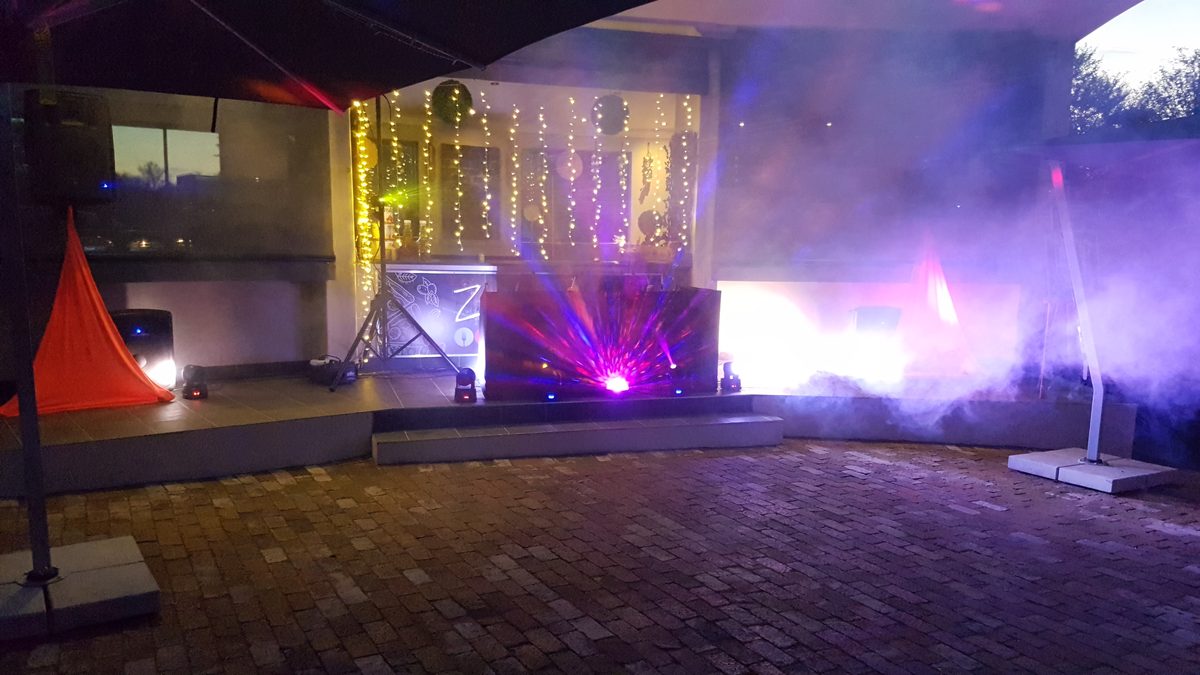 Stage lighting, haze and moving lights set up for an evening event