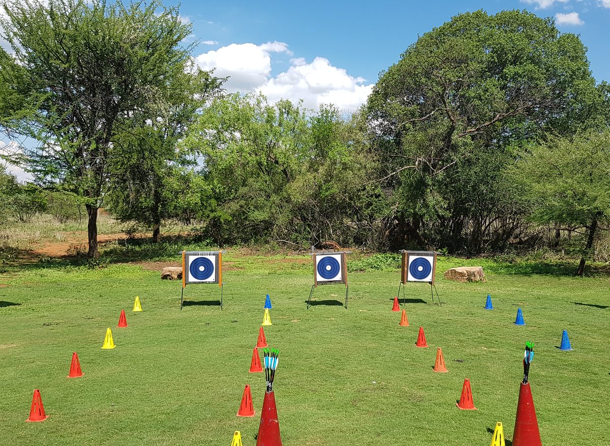 Archery range with targets and cones set up for a team building challenge