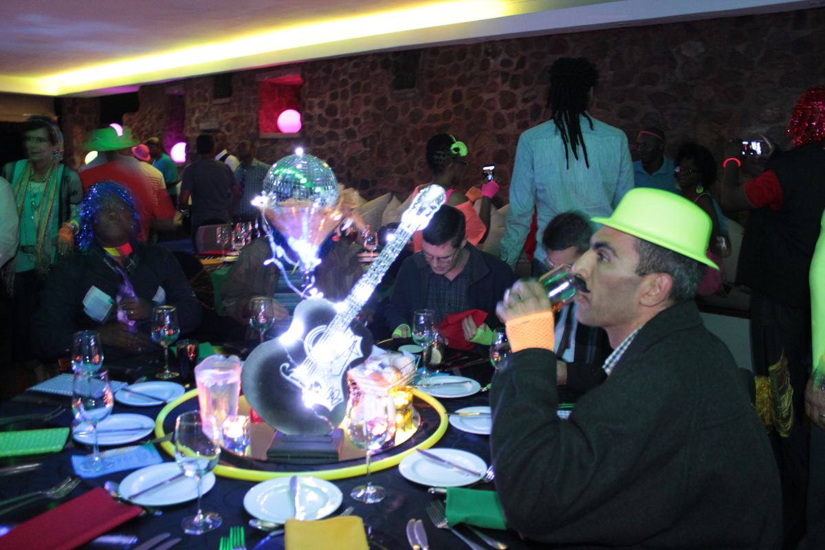 Guests dressed up for an 80s themed year-end evening