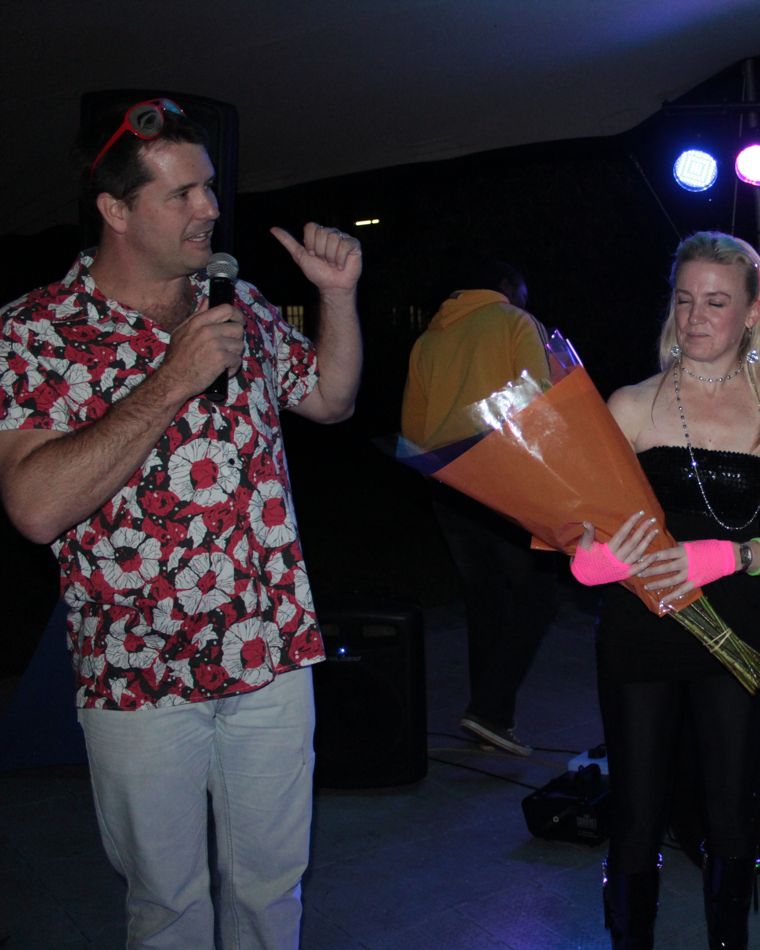 MC hosting a staff awards ceremony at a year-end function