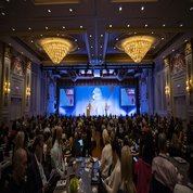 Large corporate conference in a hotel ballroom